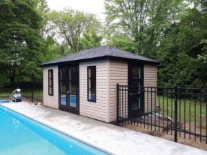 shed with fence near an in-ground pool